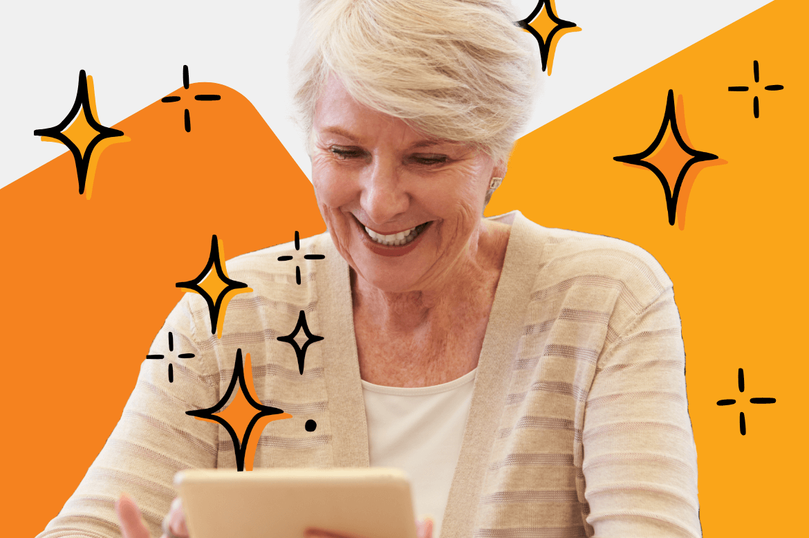 Female senior teacher looking at her tablet and smiling