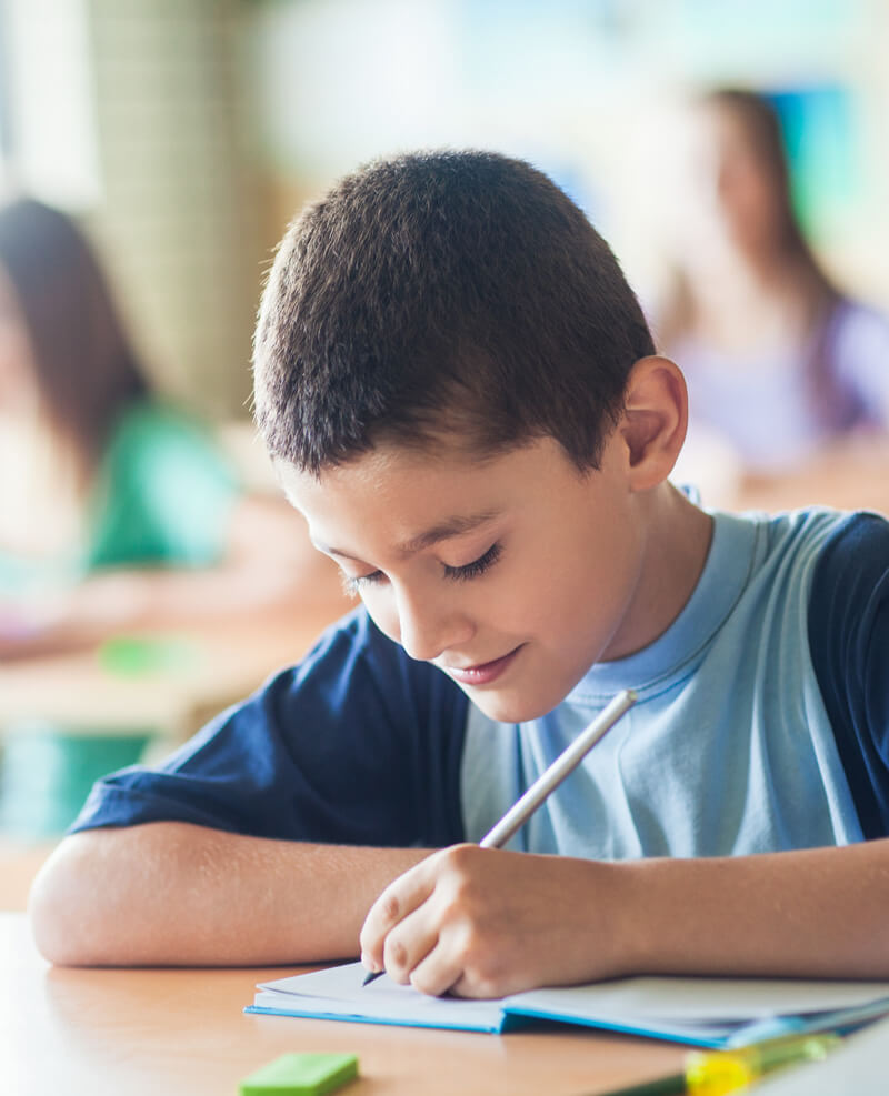 Boy writing notes